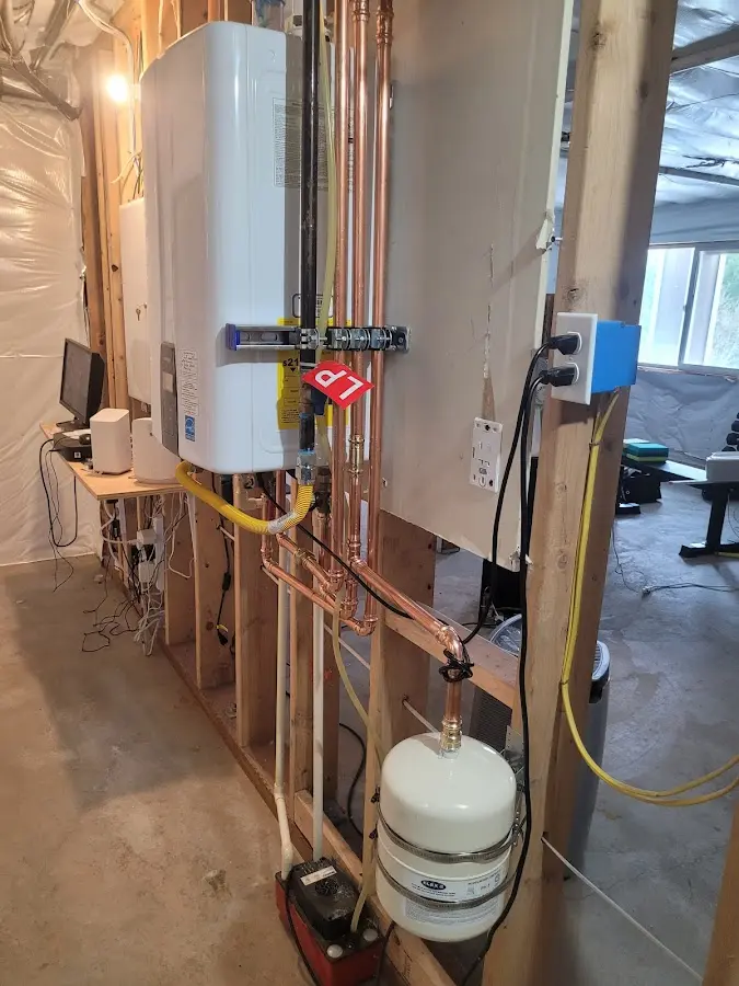 Licensed plumber repairing a kitchen sink in Commerce City